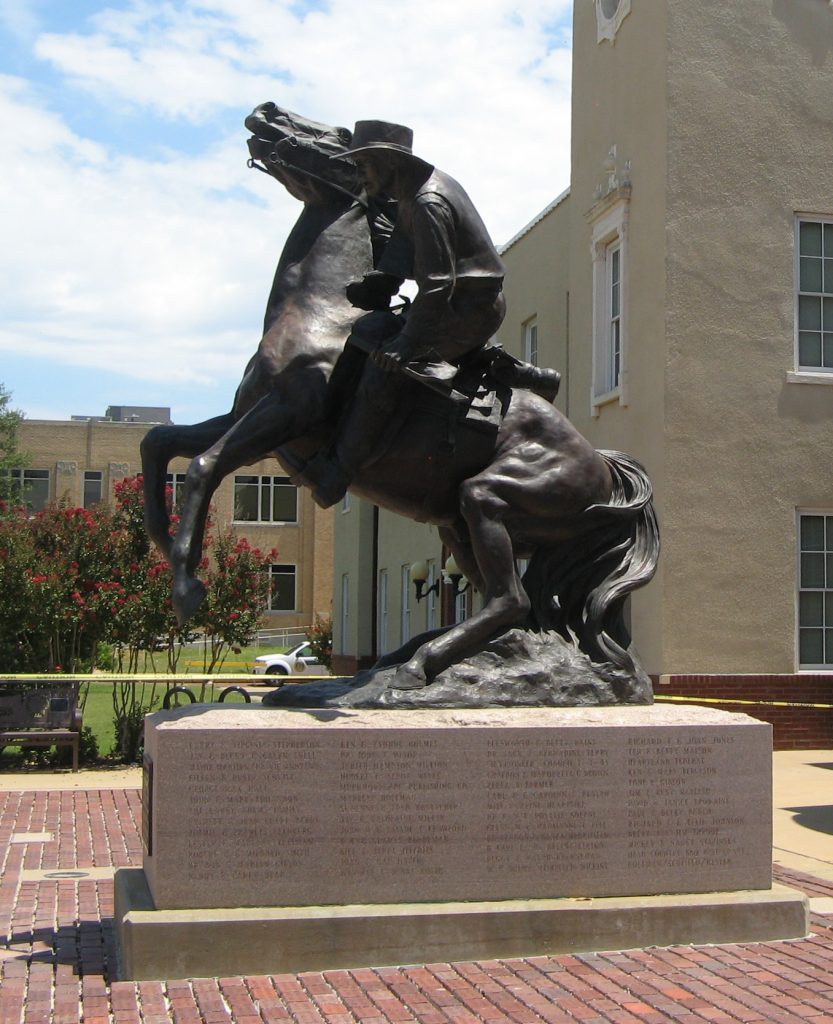Bronze statue of a man on a rearing horse